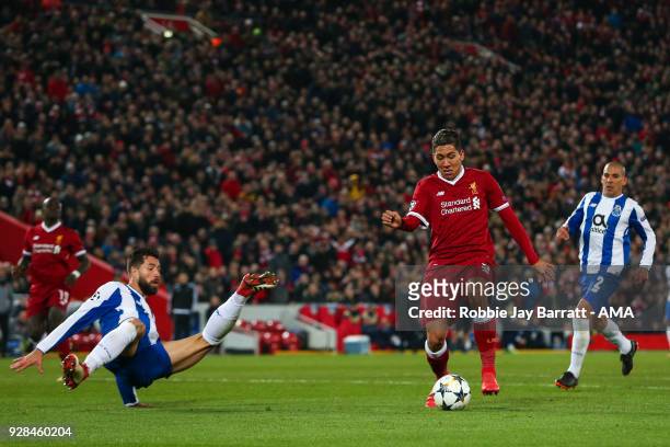 Felipe of FC Porto and Roberto Firmino of Liverpool during the UEFA Champions League Round of 16 Second Leg match between Liverpool and FC Porto at...