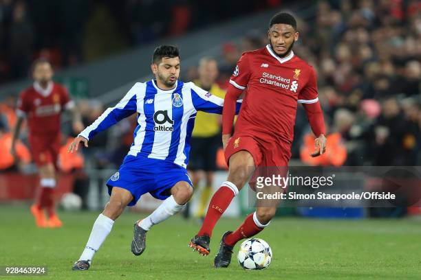 Joe Gomez of Liverpool battles with Jesus Manuel Corona of Porto during the UEFA Champions League Round of 16 Second Leg match between Liverpool and...