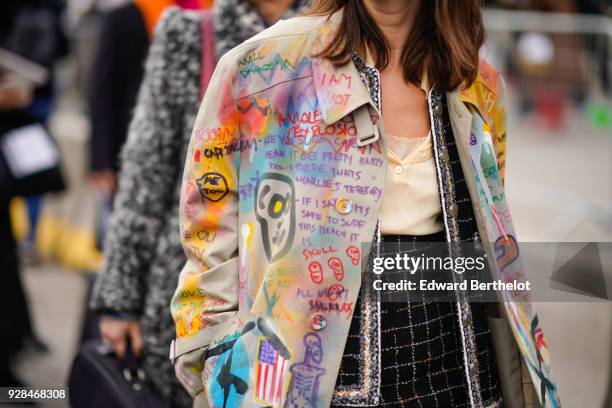 Natasha Goldenberg wears sunglasses, a multi color jacket, a tweed outfit, white shoes, outside Chanel, during Paris Fashion Week Womenswear...