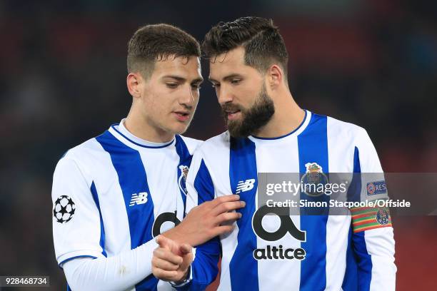 Diogo Dalot of Porto talks to teammate Felipe of Porto at the end of the UEFA Champions League Round of 16 Second Leg match between Liverpool and FC...