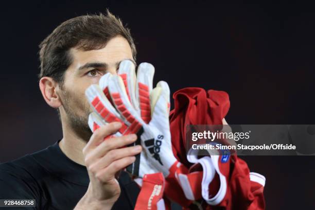 Porto goalkeeper Iker Casillas looks dejected as he applauds the support at the end of the UEFA Champions League Round of 16 Second Leg match between...