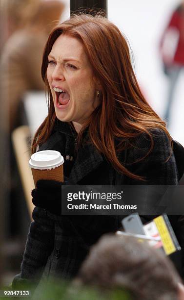 Actress Julianne Moore works on the set of the television show "30 Rock" on location on the streets of Manhattan on November 5, 2009 in New York City.