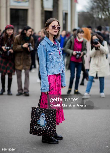 Guest wearing denim jacket, Coach bag seen outside Miu Miu during Paris Fashion Week Womenswear Fall/Winter 2018/2019 on March 6, 2018 in Paris,...