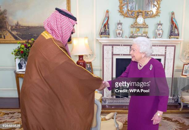 Queen Elizabeth II greets Mohammed bin Salman, the Crown Prince of Saudi Arabia, during a private audience at Buckingham Palace on March 7, 2018 in...