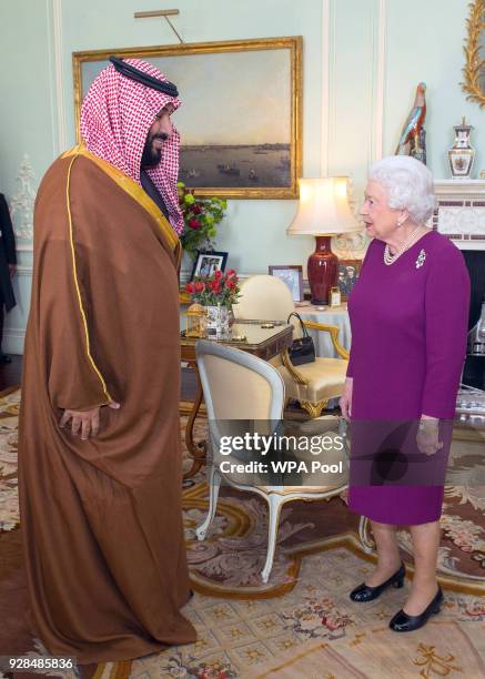 Queen Elizabeth II greets Mohammed bin Salman, the Crown Prince of Saudi Arabia, during a private audience at Buckingham Palace on March 7, 2018 in...