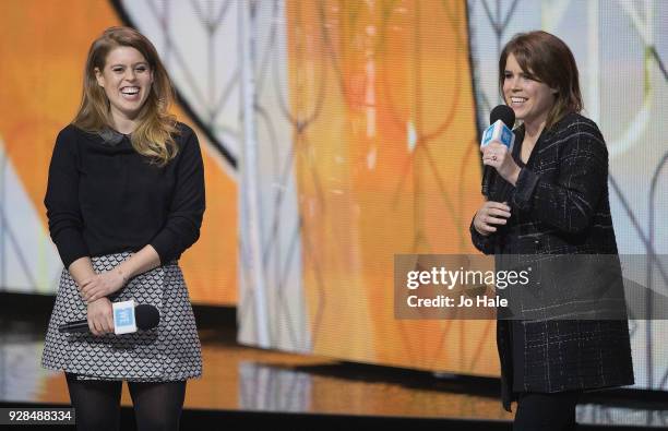 Princess Beatrice and Princess Eugenie on stage at We Day UK at Wembley Arena on March 7, 2018 in London, England.