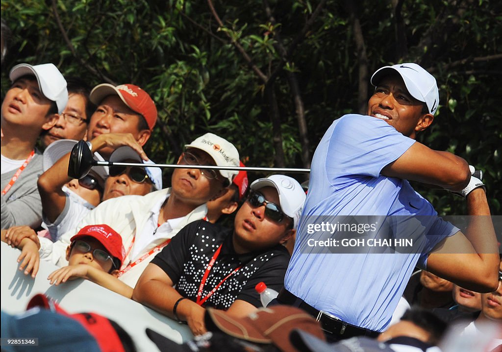Tiger Woods of the US tees off during th
