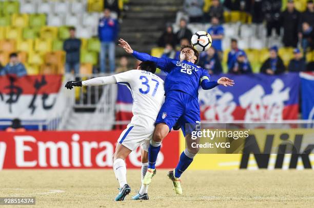 Yeom Ki-Hun of Suwon Samsung Bluewings and Sun Shilin of Shanghai Shenhua compete for the ball during the AFC Champions League Group H match between...