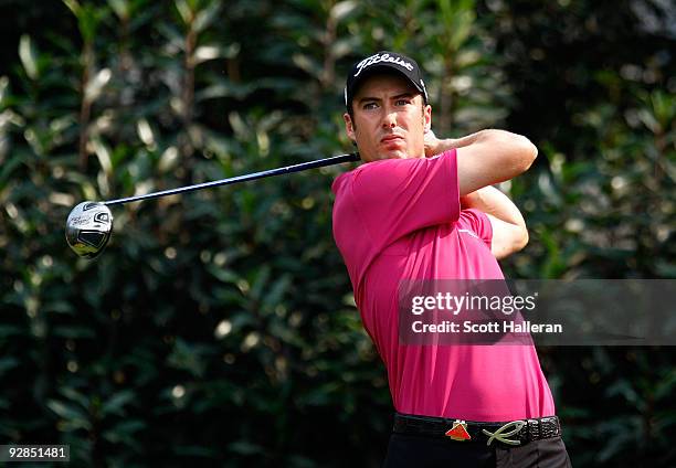 Ross Fisher of England watches his tee shot on the fifth hole during the second round of the WGC-HSBC Champions at Sheshan International Golf Club on...