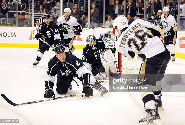 Jonathan Quick and Matt Greene of the Los Angeles Kings bend to block a shot by Ruslan Fedotenko of the Pittsburgh Penguins during the third period...