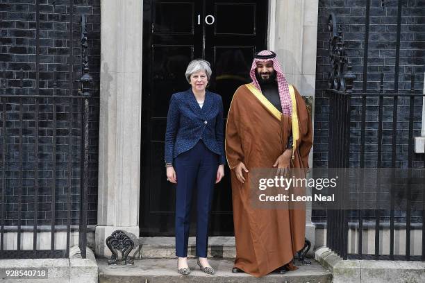 British Prime Minister Theresa May stands with Saudi Crown Prince Mohammed bin Salman on the steps of number 10 Downing Street on March 7, 2018 in...