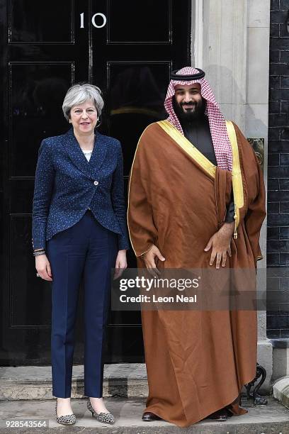 British Prime Minister Theresa May stands next to Saudi Crown Prince Mohammed bin Salman on the steps of number 10 Downing Street on March 7, 2018 in...