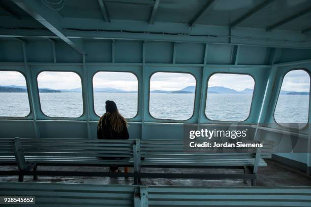 a young woman on a boat - washington state ferry stock pictures, royalty-free photos & images