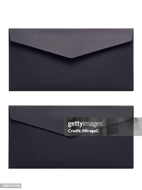 black envelope on white background - envelope stockfoto's en -beelden