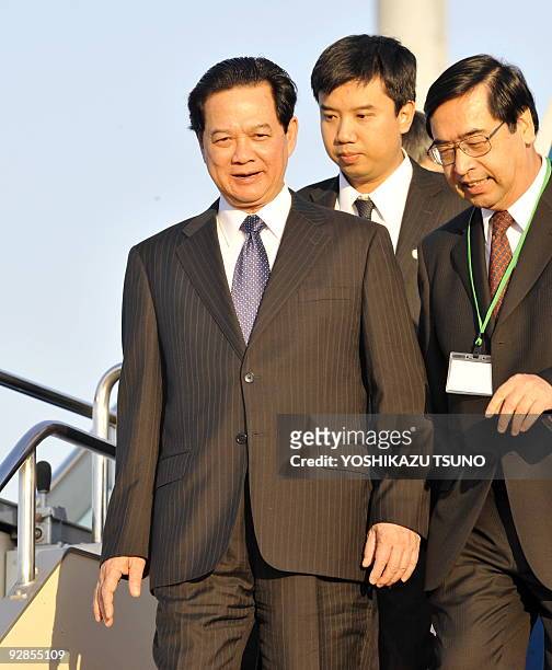 Vietnamese Prime Minister Nguyen Tan Dung smiles upon his arrival at the Tokyo International Airport on November 6, 2009. Japan and five Southeast...