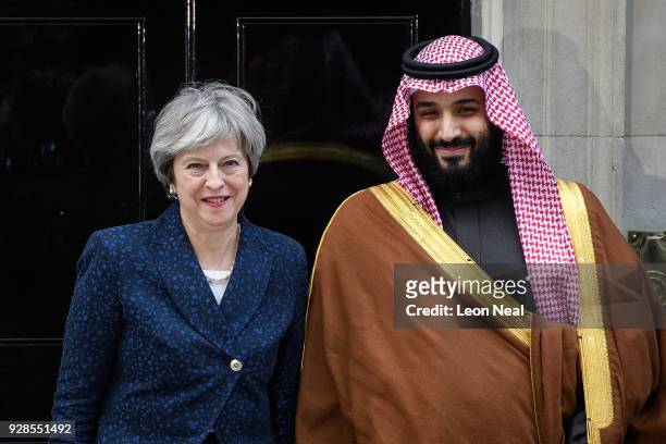 British Prime Minister Theresa May stands with Saudi Crown Prince Mohammed bin Salman on the steps of number 10 Downing Street on March 7, 2018 in...