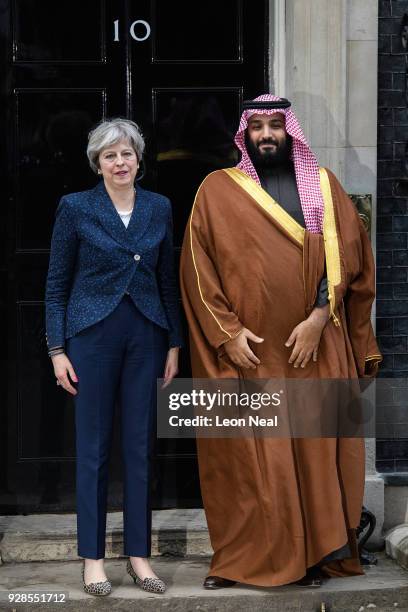 British Prime Minister Theresa May stands with Saudi Crown Prince Mohammed bin Salman on the steps of number 10 Downing Street on March 7, 2018 in...