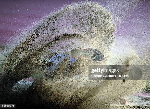 An athlete competes during the men's long jump event of the Adidas Track Classic meeting in Carson, California, on May 16, 2009. AFP PHOTO/GABRIEL...