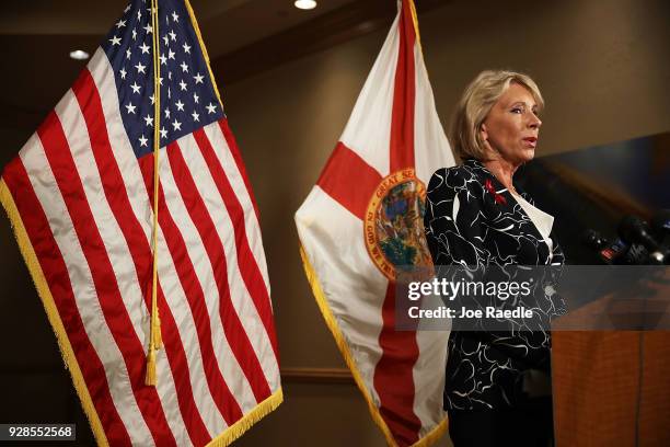 Education Secretary Betsy DeVos speaks to the news during a press conference held at the Heron Bay Marriott about her visit to Marjory Stoneman...