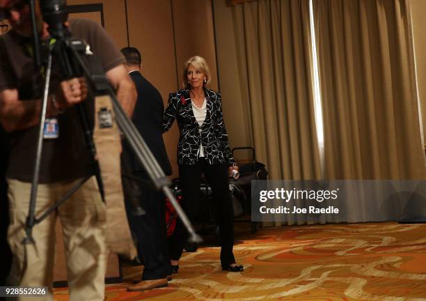 Education Secretary Betsy DeVos arrives for a news conference held at the Heron Bay Marriott about her visit to Marjory Stoneman Douglas High School...