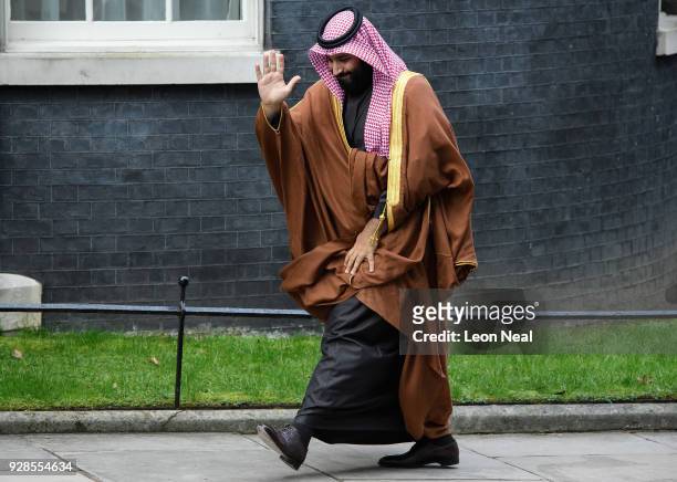 Saudi Crown Prince Mohammed bin Salman waves as he arrives for a meeting with British Prime Minister Theresa May in number 10 Downing Street on March...