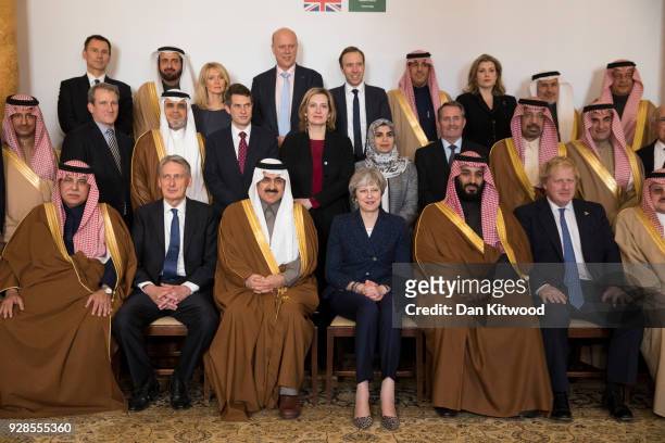 British Prime Minister Theresa May and Saudi Crown Prince Mohammed bin Salman pose for a photograph with other members of the British government and...