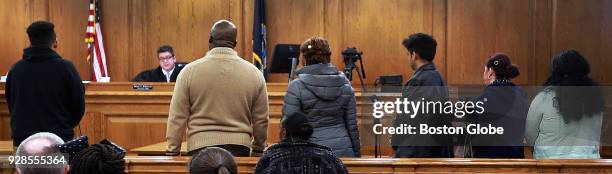 Defendants wait their turn to appear before Judge Daniel P. McKiernan during a night court session where many people sought to challenge speeding...