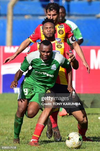 Kenya's Gor Mahia Jacques Tuyisenge outruns Tunisia's Esperance sportive de Tunis Ivorian midfielder Fousseny Coulibaly during their Confederation of...