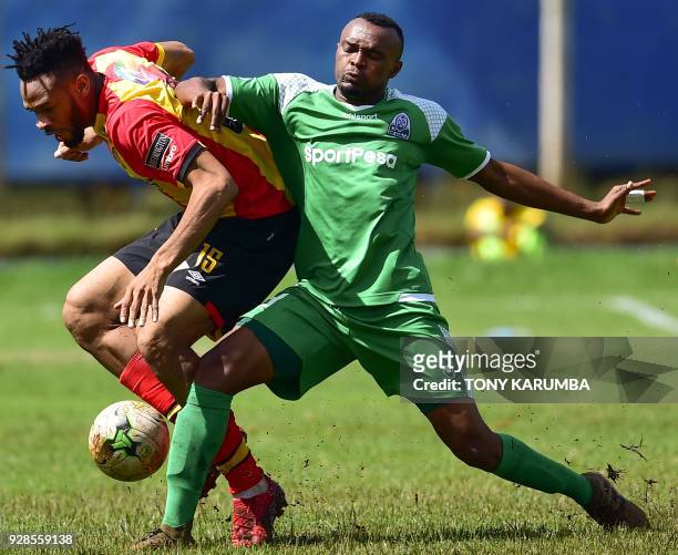 Kenya's Gor Mahia Jacques Tuyisenge tackles Tunisia's Esperance sportive de Tunis Ivorian midfielder Fousseny Coulibaly during their Confederation of...