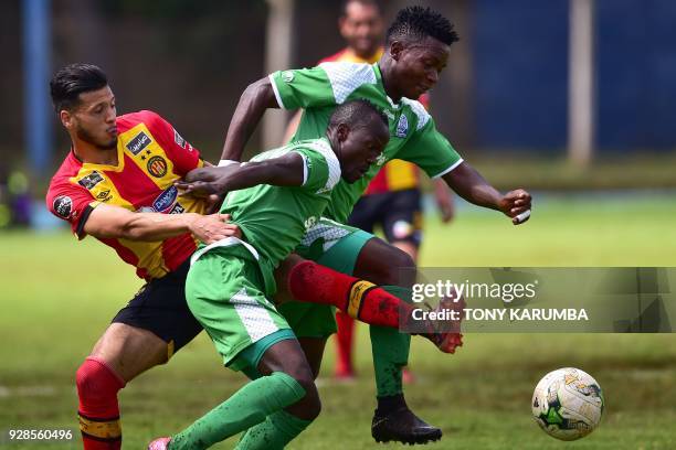 Tunisia's Esperance sportive de Tunis Anice Badri attempts to tackles Kenya's Gor Mahia Godfrey Walusimbi and George Odhiambo during their...