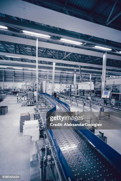 production line and machines in water bottling factory - fog machine stock pictures, royalty-free photos & images