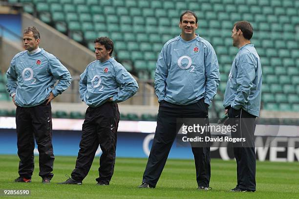 England manager Martin Johnson and his coaches Jon Callard , Mike Ford and John Wells look on during the England training session at Twickenham on...