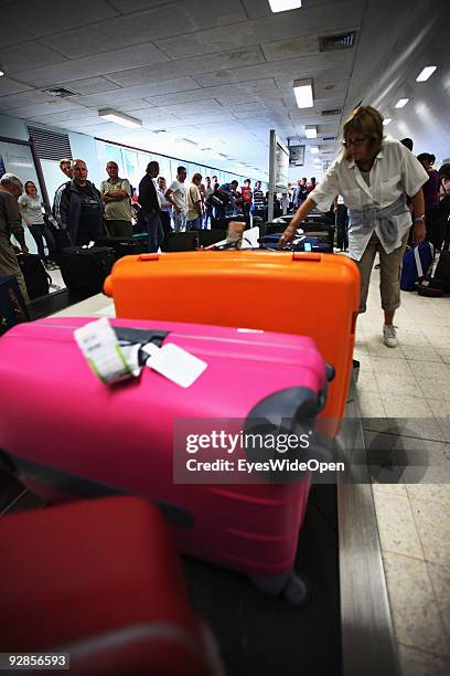 Passenger waiting for their luggage at arrival at Male International Airport on September 27, 2009 in Male, Maldives. The maldive islands consist of...