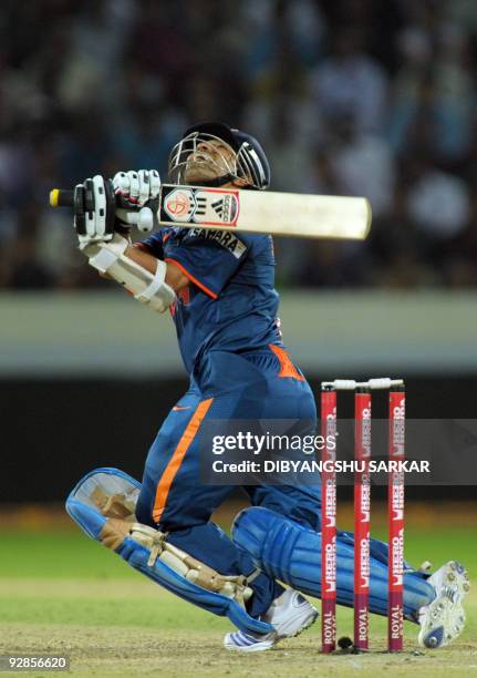 Indian cricketer Sachin Tendulkar looks up after hitting the ball high in the air, during the fifth One-Day International between India and Australia...