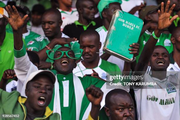 Kenyan fans cheer Kenya's Gor Mahia's team during their Confederation of African Football Champions League, first round match against Tunisia's...