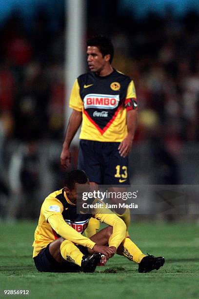 Pavel Pardo and Adolfo Rosinei of Aguilas del America react after a missed chance of goal in a Mexican league Apertura 2009 soccer match against...