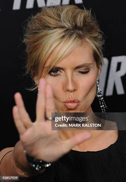 Model Heidi Klum flashes a "Star Trek" salute as she arrives at Grauman's Chinese Theatre in Hollywood for the premiere of the movie "Star Trek" in...