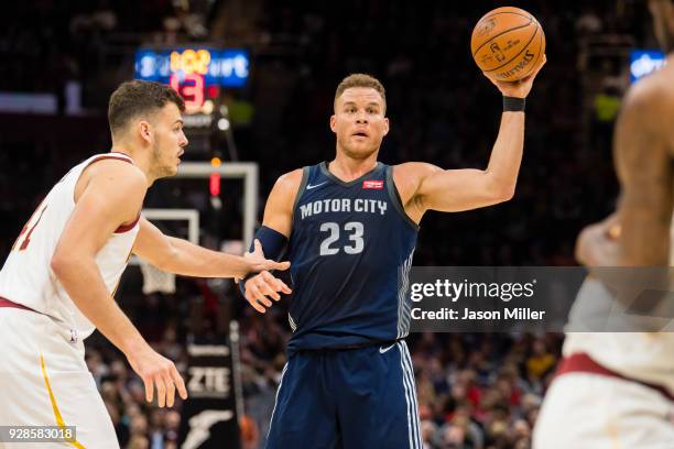 Ante Zizic of the Cleveland Cavaliers guards Blake Griffin of the Detroit Pistons during the first half at Quicken Loans Arena on March 5, 2018 in...