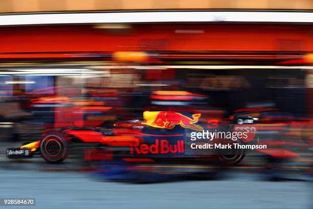 Daniel Ricciardo of Australia driving the Aston Martin Red Bull Racing RB14 TAG Heuer makes a pit stop for new tyres during day two of F1 Winter...