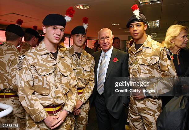 Sir Bobby Charlton poses with members of The Royal Regiment Second Fusiliers before the official unveiling of the sculpture of Sir Alf Ramsey at...