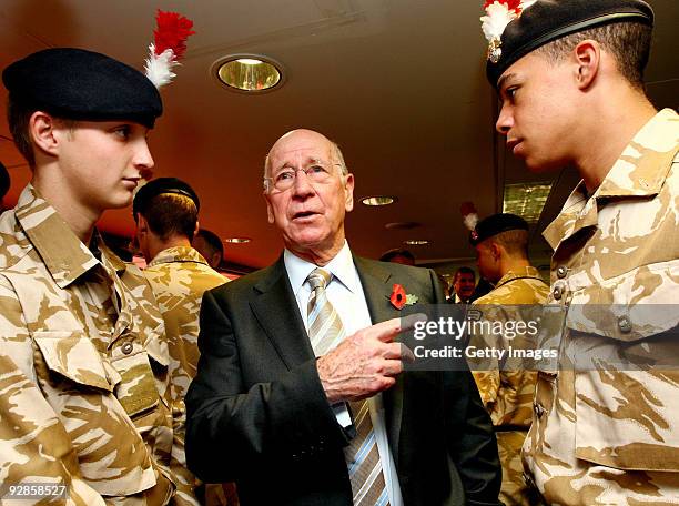 Sir Bobby Charlton talks to members of The Royal Regiment Second Fusiliers before the official unveiling of the sculpture of Sir Alf Ramsey at...