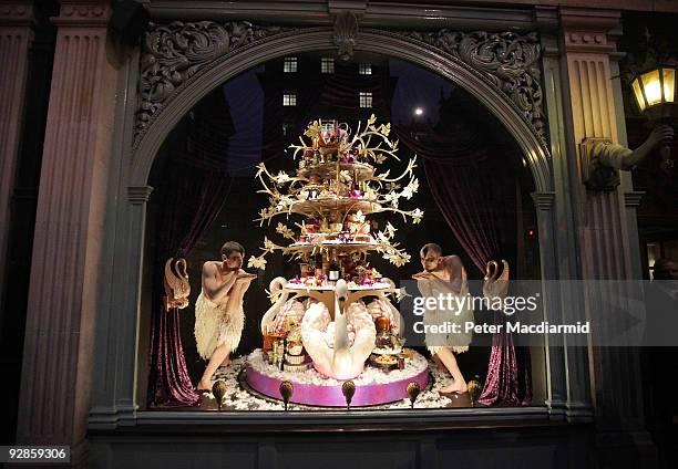 Ballet dancers from Sadler's Wells Theatre pose in the newly unveiled Christmas window of Fortnum & Mason grocery store on November 6, 2009 in...