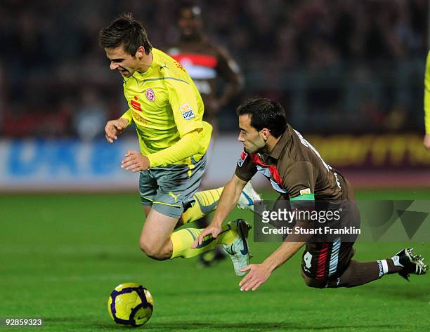 Fabio Morena of St.Pauli is challenged by Martin Harnik of Duesseldorf during the Second Bundesliga match between FC St. Pauli and Fortuna...