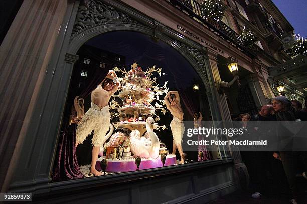 Ballet dancers from Sadler's Wells Theatre pose in the newly unveiled Christmas window of Fortnum & Mason grocery store on November 6, 2009 in...