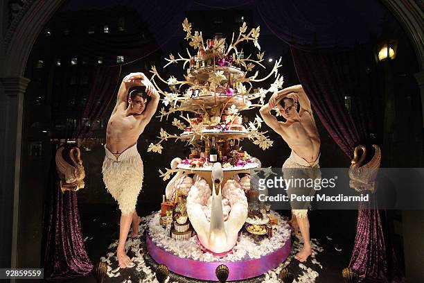 Ballet dancers from Sadler's Wells Theatre pose in the newly unveiled Christmas window of Fortnum & Mason grocery store on November 6, 2009 in...