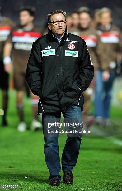 Head coach Norbert Meier of Duesseldorf leaves the pitch during the half time of the Second Bundesliga match between FC St. Pauli and Fortuna...
