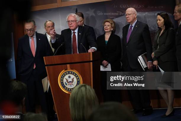 Sen. Bernie Sanders speaks as Senate Minority Leader Sen. Chuck Schumer , Sen. Tom Carper , Sen. Debbie Stabenow , Sen. Pat Leahy , Sen. Maria...