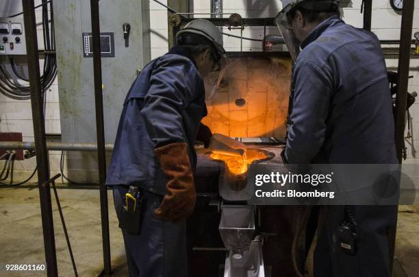 Workers prepare to make a magnesium ingot at the Alliance Magnesium Inc. Facility in Danville, Quebec, Canada, on Friday, Feb. 9, 2018. Quebec once...