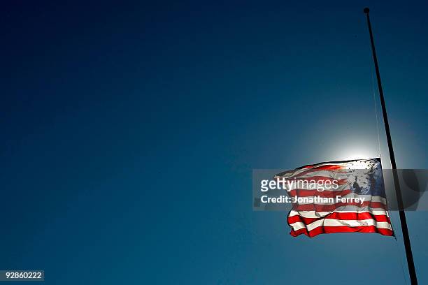 The American Flag flies at half-mast during practice for the NASCAR Nationwide Series O'Reilly Challenge at Texas Motor Speedway on November 6, 2009...
