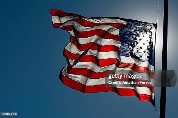 The American Flag flies at half-mast during practice for the NASCAR Nationwide Series O'Reilly Challenge at Texas Motor Speedway on November 6, 2009...